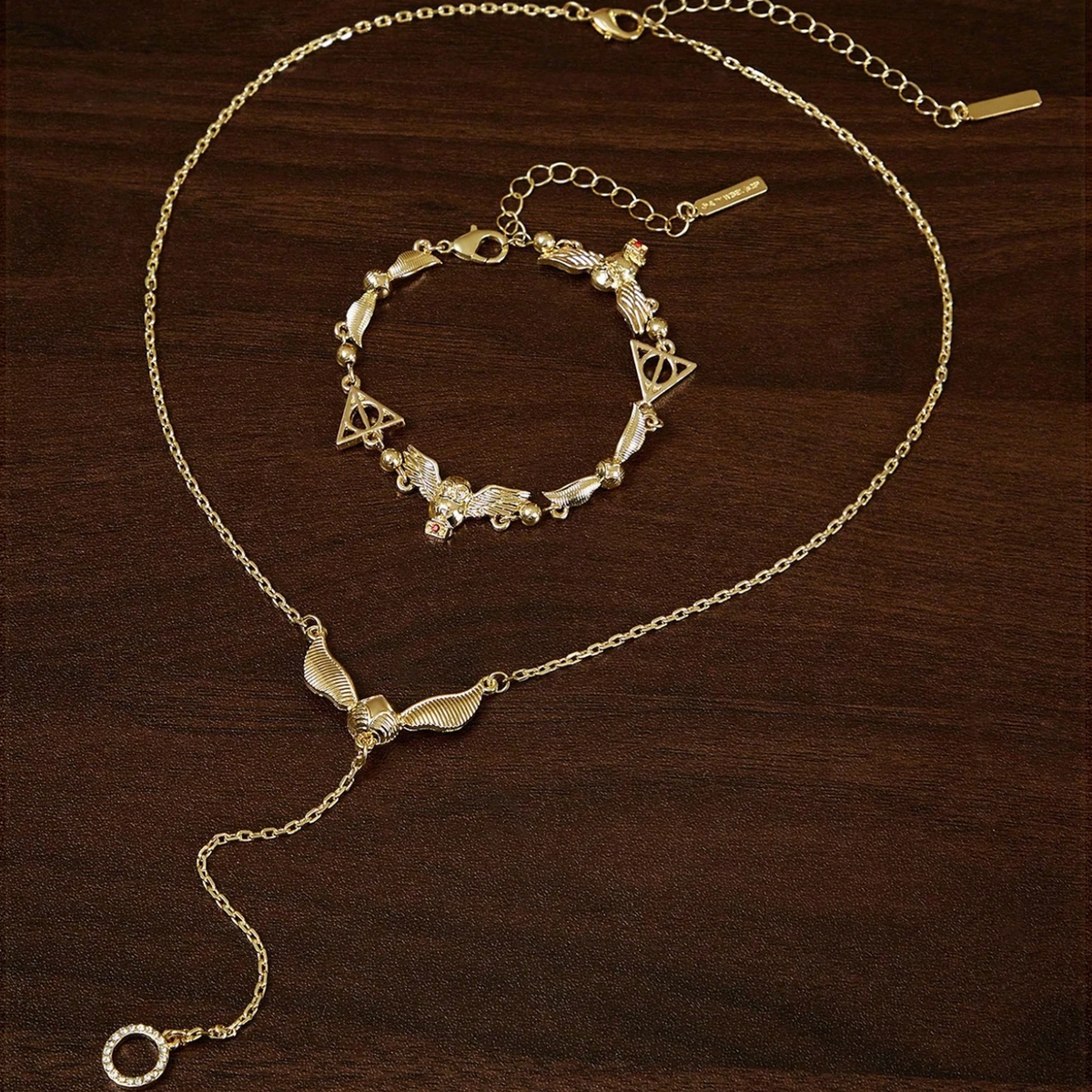 Set de collar y pulsera snitch - Harry Potter